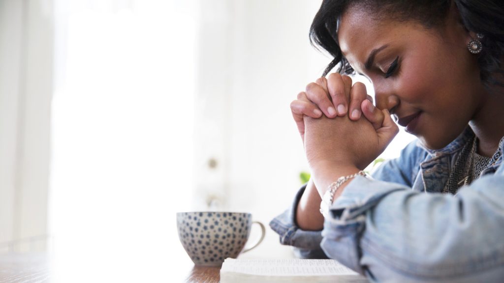 black woman praying 